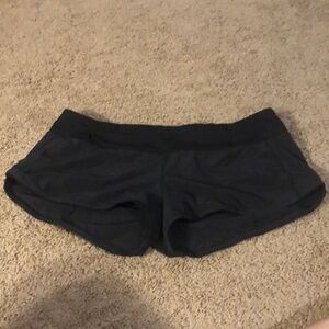 Lulu Lemon. Size 10. Black Athletic Shorts with Curved Hem and Stretchy Fabric